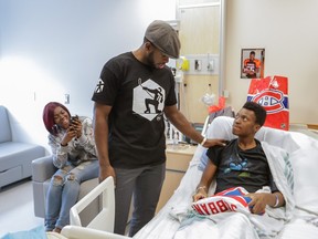 Montreal Canadiens defenceman P. K. Subban meets with 16-year-old patient Harmony Stone, right, and his sister Michelle during a visit to the Montreal Children's Hospital on Sunday.