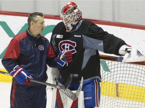 Back in the spotlight: Canadiens goalie Mike Condon, speaking with Stéphane Waite during practice on Nov. 30, 2015, is expected to see the lion’s share of action in nets as Carey Price will miss a minimum of six weeks with a lower body injury. (John Kenney / MONTREAL GAZETTE)