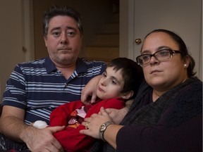 Ten-year-old Domenic Santone is held by his father, John Santone, and mother Sarina Ferrara in Montreal on Friday November 6, 2015.  Dominic is mentally and physically disabled and was badly burned he pulled a coffee pot on to himself while at school.