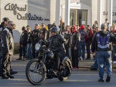 A motorcyclist leaves the Alfred Dallaire Funeral Home in Repentigny on Saturday, November 7, 2015.