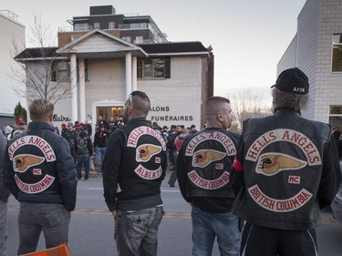 Hells Angels from British Columbia stand outside the Alfred Dallaire Funeral Home in Repentigny on Saturday, November 7, 2015. Hundreds of Members of several motorcycle clubs from across Canada gather for the funeral of 63-year-old Lionel Deschamps, a member of Hells Angels Montreal chapter.