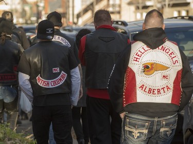 Members of several motorcycle clubs from across Canada leave the Alfred Dallaire Funeral Home in Repentigny as they walk to the church for the funeral service of 63-year-old Lionel Deschamps, a member of Hells Angels Montreal chapter, Saturday, November 7, 2015.