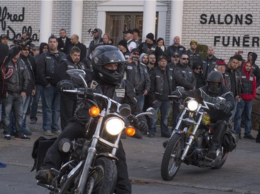 Motorcyclists leave the Alfred Dallaire Funeral Home in Repentigny on Saturday, November 7, 2015. as hundreds of members of several motorcycle clubs from across Canada gather for the funeral of 63-year-old Lionel Deschamps, a member of Hells Angels Montreal chapter.