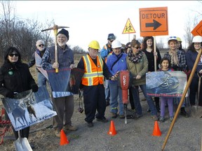 Sauvons l'Anse-à-l'Orme supporters are reunited during a photo-op organized on Saturday Nov. 7, 2015, to draw attention to the fight for the protection and conservation of the l'Anse-à-l'Orme nature corridor in Pierrefonds.