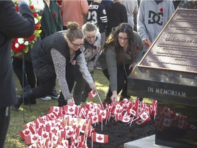 Students from MacDonald High School and McGill University joined the war veterans and members of the Canadian Grenadier Guards to mark Remembrance Day on November 5, 2015 at the memorial Field in Ste-Anne-de-Bellevue. At the end of the ceremony, students were invited to put a small Canadian flag besides the Remembrance Day commemorative plaque.