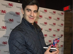 Montreal Canadiens Max Pacioretty checks out his likeness at the launch of a new line of hockey miniatures.