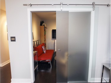 A frosted glass sliding panel closes the doorway into the den. (John Mahoney / MONTREAL GAZETTE)