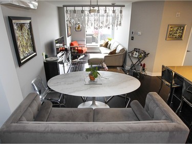 A sofa and clear chairs surround the Carrara marble table in the dining area. (John Mahoney / MONTREAL GAZETTE)