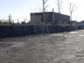 The yard of the former Reliance Power site  in Pointe Claire on the Saturday October 31, 2015. The image shows the yard and other properties on the other side of the fence. (Pierre Obendrauf / MONTREAL GAZETTE)