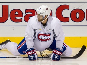 Canadiens defenceman Jarred Tinordi stretches before practice at the Bell Sports Complexe in Brossard, on Monday, September 21, 2015.