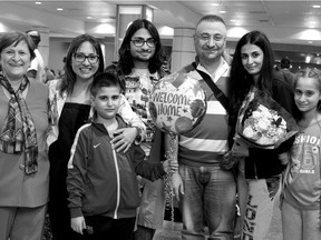 The Hamalian family poses for pictures after being re-united at Montreal-Pierre Elliott Trudeau International Airport in Montreal on Tuesday September 22, 2015. Left to right are Lala Barsemian, Sita Churugian, Nelly Hamalian, Harout Hamalian, Georgik Barsemian, Ohannes Hamalian, Anna Kouzouian, Palig Hamalian and Wanes Barsemian. (Allen McInnis / MONTREAL GAZETTE)