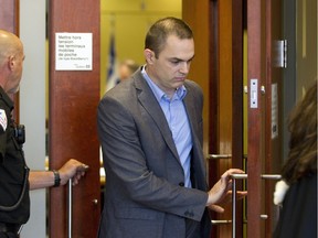Former cardiologist Guy Turcotte leaves a courtroom at the St.  Jerome courthouse in St.  Jerome, Tuesday September  29, 2015.