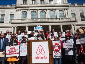 Supporters of Airbnb hold a rally on the steps of New York City Hall showing support for the company on October 30, 2015 in New York City. The New York City council is currently debating how to regulate the controversial company.