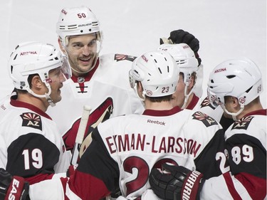 Arizona Coyotes' Oliver Ekman-Larsson (23) celebrates with teammates Shane Doan (19), Antoine Vermette (50) and Mikkel Boedker (89) after scoring against the Montreal Canadiens during second period NHL hockey action in Montreal, Thursday, November 19, 2015.