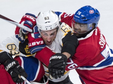 Montreal Canadiens' defender P.K. Subban, (76) holds onto Boston Bruins' Brad Marchand (63) during second period NHL hockey action, in Montreal, on Saturday, Nov. 7, 2015.