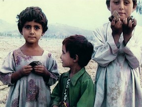 Palestinian children play with pieces of a drone missile that killed their family in Tonje Hessen Schei's documentary Drone.