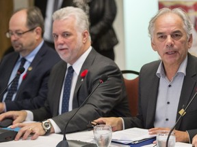 Quebec Premier Philippe Couillard and Ghyslain Picard, Regional Assembly of First Nations Chief of Quebec and Labrador, sit at the head of the table during a meeting with native leaders Wednesday, November 4, 2015 in Montreal.