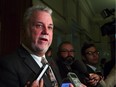 Quebec Premier Philippe Couillard talks about Remembrance day at the Quebec legislature, Wednesday Nov. 11, 2015.