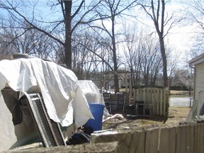 Photograph of material in lot on Ile-Claude Road in Ile-Perrot that were submitted to Quebec Superior Court by the town of Ile-Perrot. The municipality is asking the court for permission to clean the lot and bill the owners. Some of the materials end up in the river (seen in the background) when the water rises during the spring thaw period. Photo courtesy of the town of Ile-Perrot.