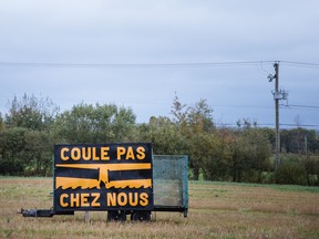 A sign protesting the TransCanada Energy East Pipeline project on a field near Highway 40 in the town of Donnacona, 226 kilometres east of Montreal, on Sept. 29, 2015. The Energy East project is a proposed 4,600 kilometre-long pipeline that would carry about 1.1 million barrels of crude oil per day from Alberta and Saskatchewan to petroleum refineries in eastern provinces.