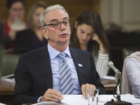 The Quebec government's Unity permanente anti-corruption (UPAC) Commissioner Robert Lafrenière testifies at a legislature committee, Monday Nov. 2, 2015, at the Quebec Legislature in Quebec City.