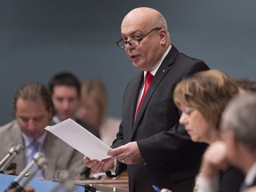 File photo: Quebec Transport Minister Robert Poëti tables  legislation on Nov. 12, 2015 at the legislature in Quebec City.