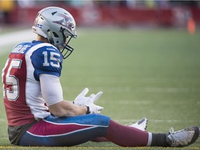 Montreal Alouettes' Samuel Giguère sits on the field after failing to catch the ball during overtime CFL football action against the Saskatchewan Roughriders in Montreal, on Sunday, Nov. 8, 2015.