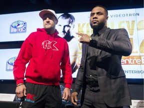 Light-heavyweight champion Sergey Kovalev from Russia, left, and challenger Jean Pascal of Laval pose for the cameras following a news conference in Montreal Monday, November 30, 2015, ahead of their title fight which takes place on January 30, 2016.
