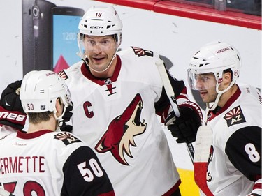 Arizona Coyotes' Shane Doan (19) celebrates with teammates Antoine Vermette (50) and Tobias Rieder after scoring against the Montreal Canadiens during first period NHL hockey action in Montreal, Thursday, November 19, 2015.