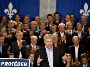 Conservative leader Stephen Harper speaks at a rally during a campaign stop in Quebec City on Wednesday, September 30, 2015.
