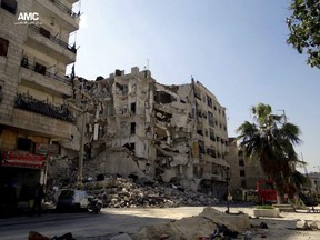 Authenticated image taken by a citizen shows buildings damaged in a government air strike and shelling in the Bostan Pasha district in Aleppo in April 2013.