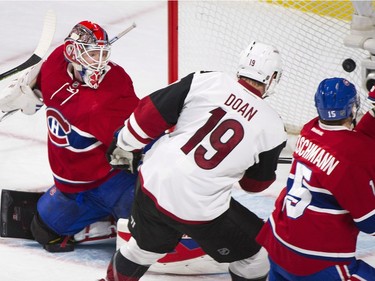 Arizona Coyotes' Shane Doan (19) scores on Montreal Canadiens goaltender Mike Condon as Canadiens' Tomas Fleischmann defends during first period NHL hockey action in Montreal, Thursday, November 19, 2015.