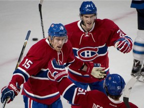 Montreal Canadiens' Tomas Fleischmann (15) celebrates his first-period goal against the Winnipeg Jets Sunday, Nov. 1, 2015 in Montreal.