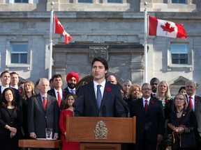 Justin Trudeau and his new cabinet speaks to the crowds and the media at Rideau Hall in Ottawa on Wednesday, Nov. 4, 2015.