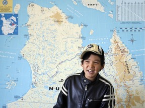 Tumasi Audlaluk, 11, plays  in the airport in the Inuit community of Puvirnituq on Hudson Bay in northern Quebec on, Aug. 5, 2007.