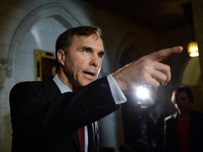 Minister of Finance Bill Morneau makes an announcement in foyer of the House of Commons on Parliament Hill in Ottawa on Friday, December 11, 2015. THE CANADIAN PRESS/Sean Kilpatrick