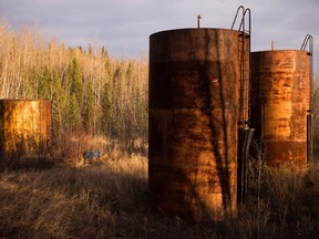 Large tanks left to rust at an abandoned oilsands mining site in Alberta. The oil and gas sector will see 100,000 job losses by the end of this year, including 40,000 direct jobs, says the president and CEO of the Canadian Association of Petroleum Producers.