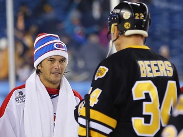 Jose Theodore #60 of the Montreal Canadiens talks with Bob Beers #34 of the Boston Bruins after the 2016 Bridgestone NHL Winter Classic  Alumni Game at Gillette Stadium on December 31, 2015 in Foxboro, Massachusetts.