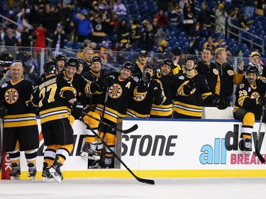 Ray Bourque #77 of the Boston Bruins celebrates with his teammates after scoring a goal against the Montreal Canadiens during the 2016 Bridgestone NHL Winter Classic  Alumni Game at Gillette Stadium on December 31, 2015 in Foxboro, Massachusetts.