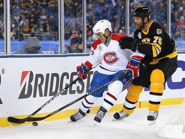 Hal Gill #75 of the Boston Bruins defends Gilbert Delorme #27 of the Montreal Canadiens during the 2016 Bridgestone NHL Winter Classic  Alumni Game at Gillette Stadium on December 31, 2015 in Foxboro, Massachusetts.