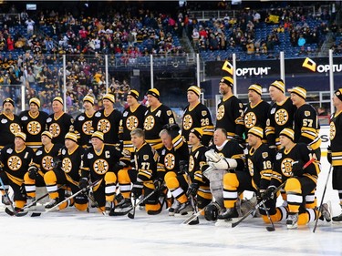 The Boston Bruins alumni team stands for a photo before the 2016 Bridgestone NHL Winter Classic Alumni Game against the Montreal Canadiens at Gillette Stadium on December 31, 2015 in Foxboro, Massachusetts.