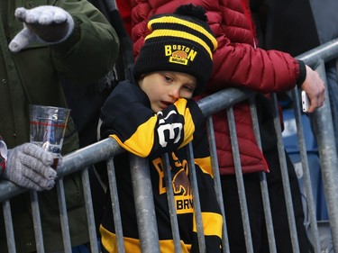 A young Bruins fan waits for the Boston Bruins and the Montreal Canadiens to take the ice during the 2016 Bridgestone NHL Winter Classic  Alumni Game at Gillette Stadium on December 31, 2015 in Foxboro, Massachusetts.
