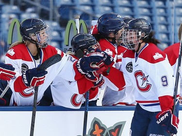 Kim Deschenes #9 of the Les Canadiennes (CWHL) celebrates her first period goal against the Boston Pride (NWHL) during the Outdoor Womens Classic at Gillette Stadium on December 31, 2015 in Foxboro, Massachusetts.