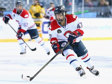 Emmanuelle Blais #47 of the Les Canadiennes (CWHL) skates against the Boston Pride (NWHL) during the Outdoor Womens Classic at Gillette Stadium on December 31, 2015 in Foxboro, Massachusetts.