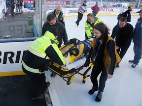 Denna Laing #24 of the Boston Pride (NWHL) is taken off the ice following an injury against the Les Canadiennes (CWHL) during the Outdoor Womens Classic at Gillette Stadium on Dec. 31, 2015 in Foxborough, Mass.