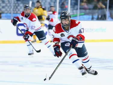 Emmanuelle Blais #47 of the Les Canadiennes (CWHL) carries the puck against the Boston pride (NWHL) during the Outdoor Womens Classic at Gillette Stadium on December 31, 2015 in Foxboro, Massachusetts.