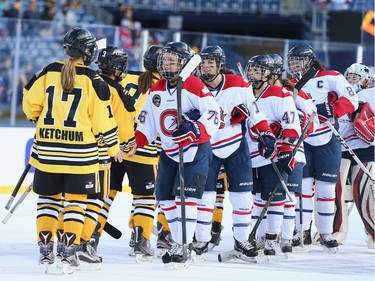 Players from the  Boston Pride (NWHL) and the Les Canadiennes (CWHL) shake hands following the Outdoor Womens Classic at Gillette Stadium on December 31, 2015 in Foxboro, Massachusetts.