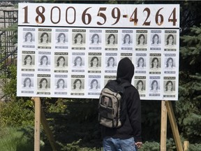 A skateboarder rides by a posting of missing Cédrika Provencher in Trois-Rivières Aug. 28, 2007.