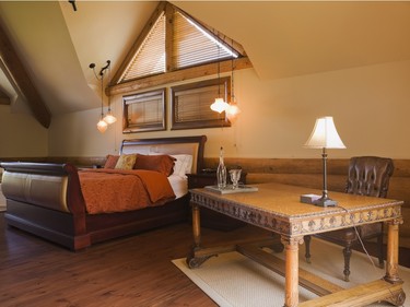 A sleigh bed and an antique desk in Renaissance style garnish the original master suite on the upper floor. (Photo by Perry Mastrovito)