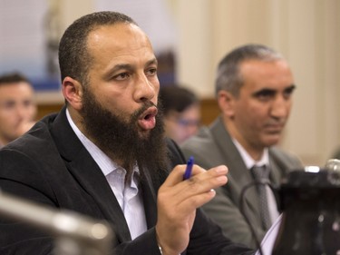 Adil Charkaoui speaks at a legislature committee studying a bill on hate speech on Tuesday, September 15, 2015 at the legislature in Quebec City. Douelmaken Cheblaoui sits by his side.